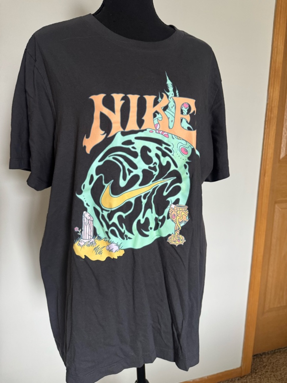 Nike Black Graphic Short Sleeve Tee with Mint, Yellow and Peach Artwork